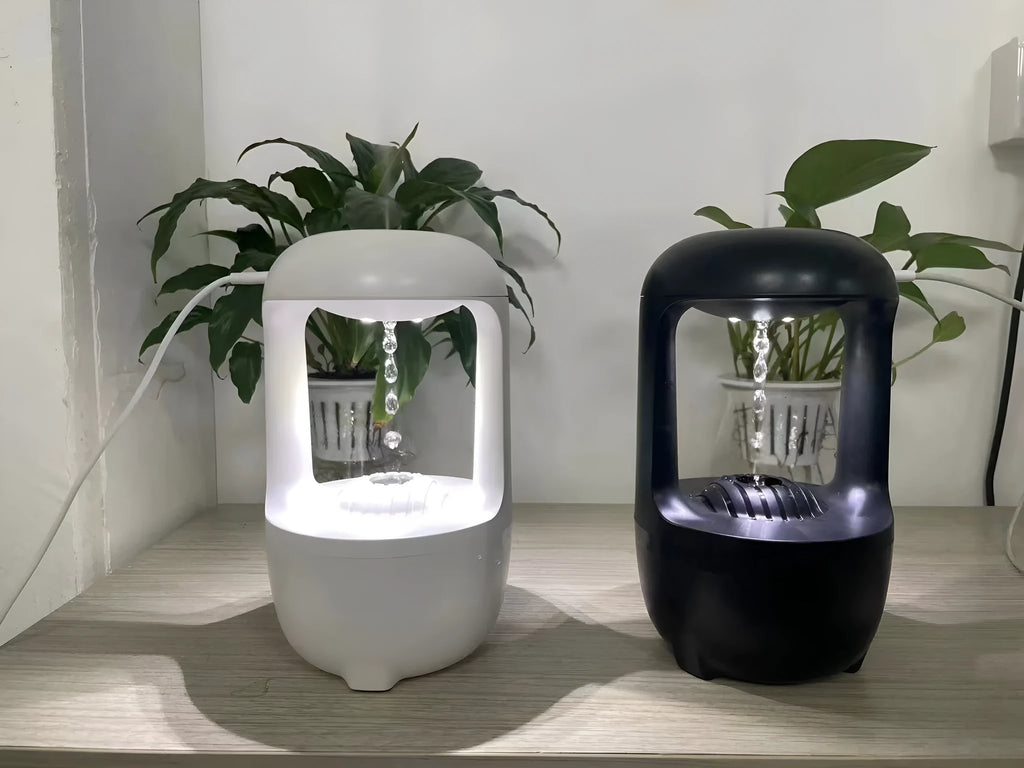 White anti-gravity humidifier showing water droplet backflow effect with USB cable connection
