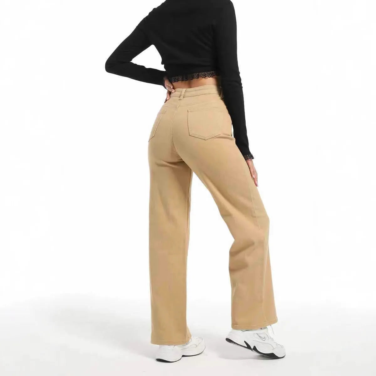 Women's high-waist straight wide-leg jeans in apricot colour, laid flat to show the cut and high-waist detail.