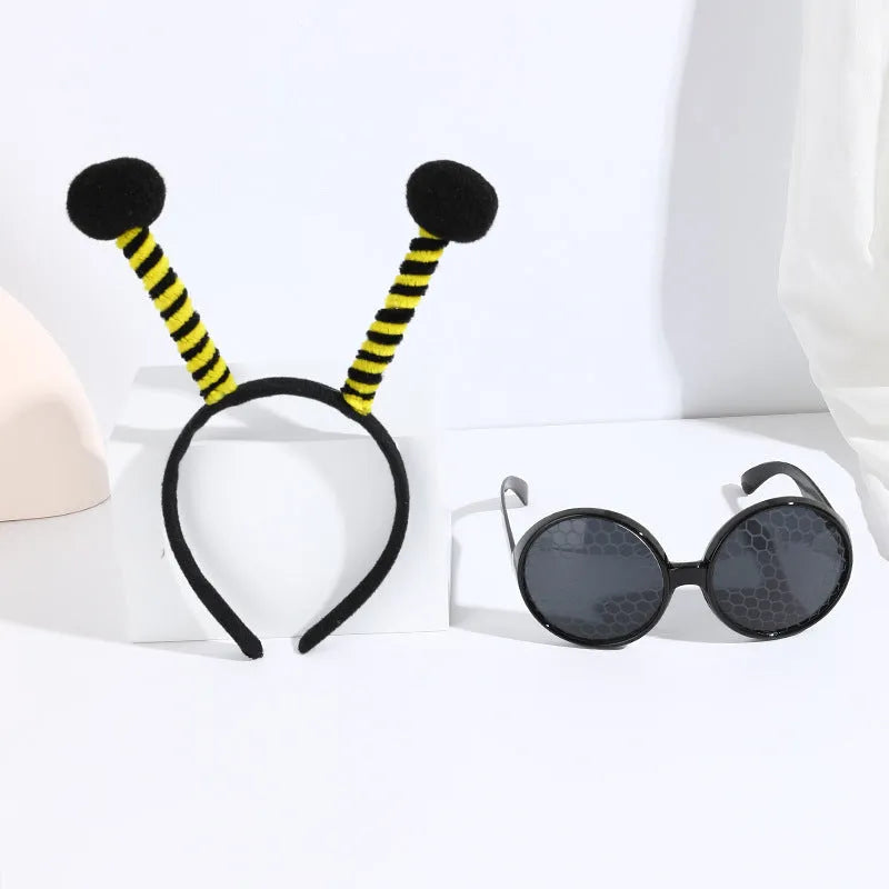 Yellow bee costume headband and matching glasses set on mannequin display