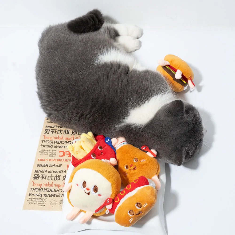 Assortment of kitten teething toys shaped like a hamburger, chicken leg, bread, fries, and hot dog.