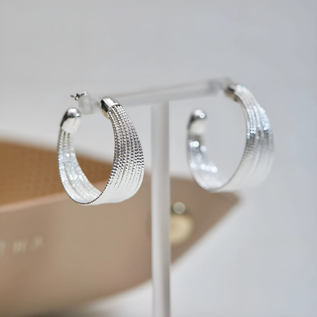 Geometric copper earrings in silver and gold finishes as clip-on and stud styles
