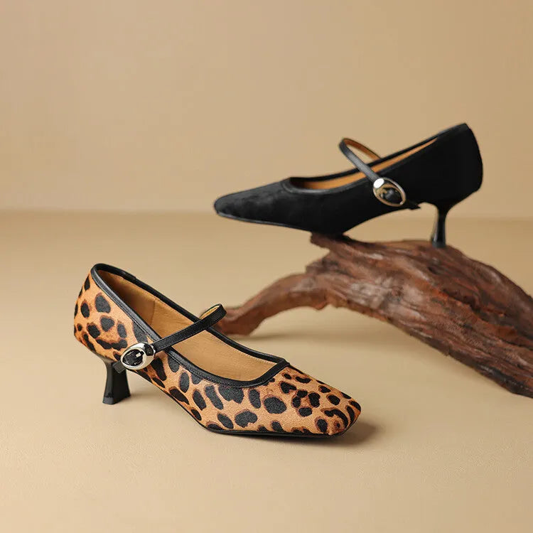 Women's black square toe stiletto ankle-strap heels with horse hair upper and buckle closure.