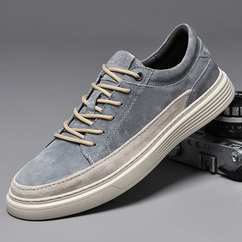 Men's grey casual leather skate shoes with round toe and lace-up front on a rubber sole.