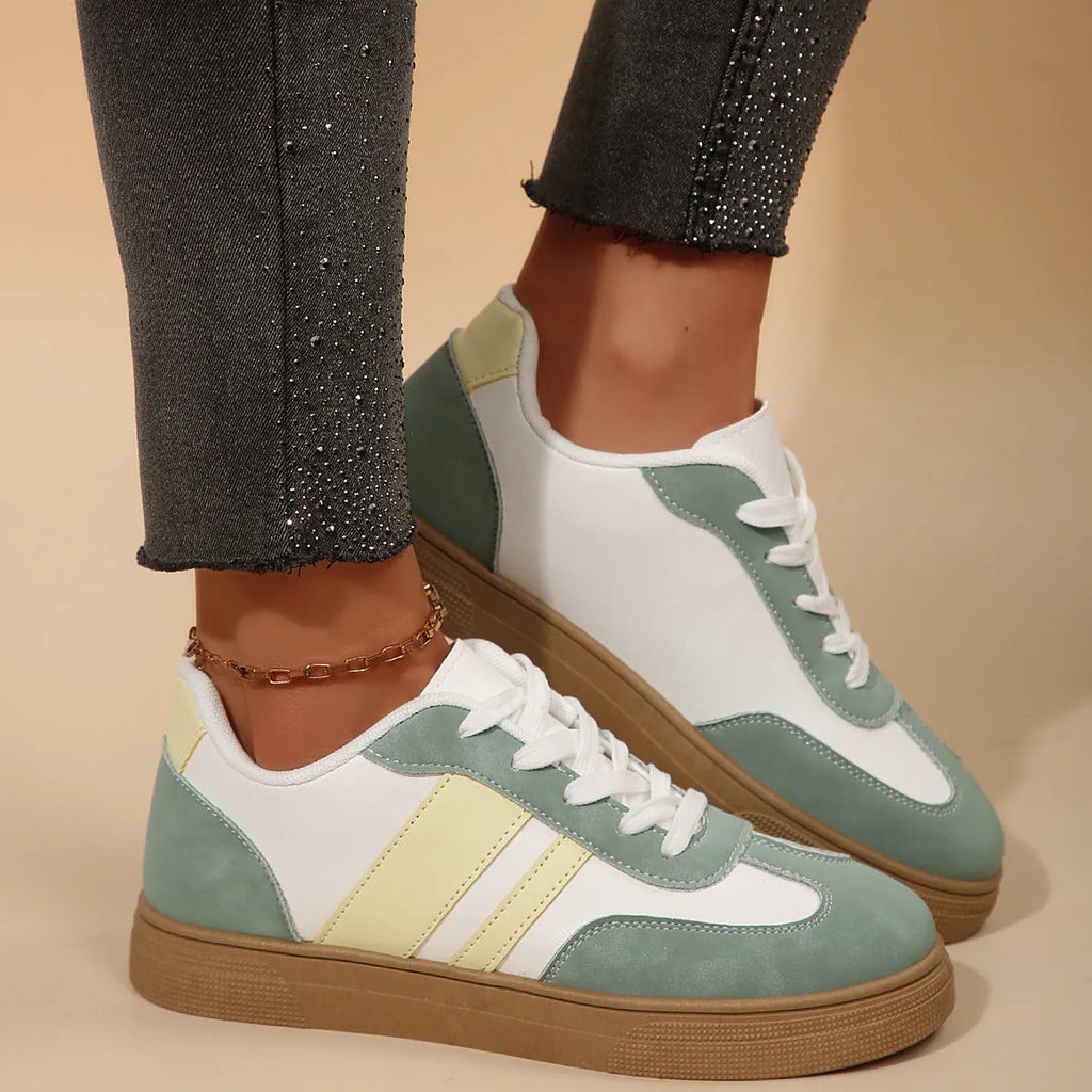 Green women's retro sports shoes with cross strap detail and round toe