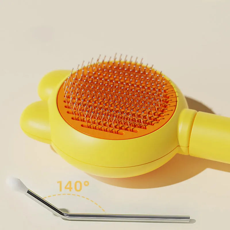 Green self-cleaning pet grooming brush with metal comb and comfort-grip handle on a wooden table.