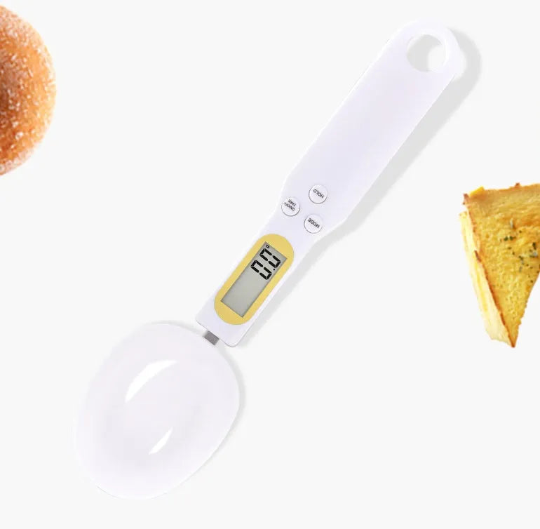Black electronic measuring spoon scale showing digital display and integrated spoon design for kitchen weighing