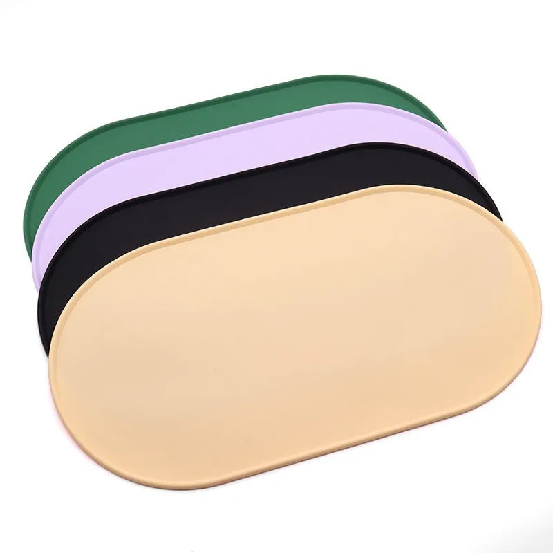 Silicone waterproof cat feeding placemat in green, shown under a food bowl.
