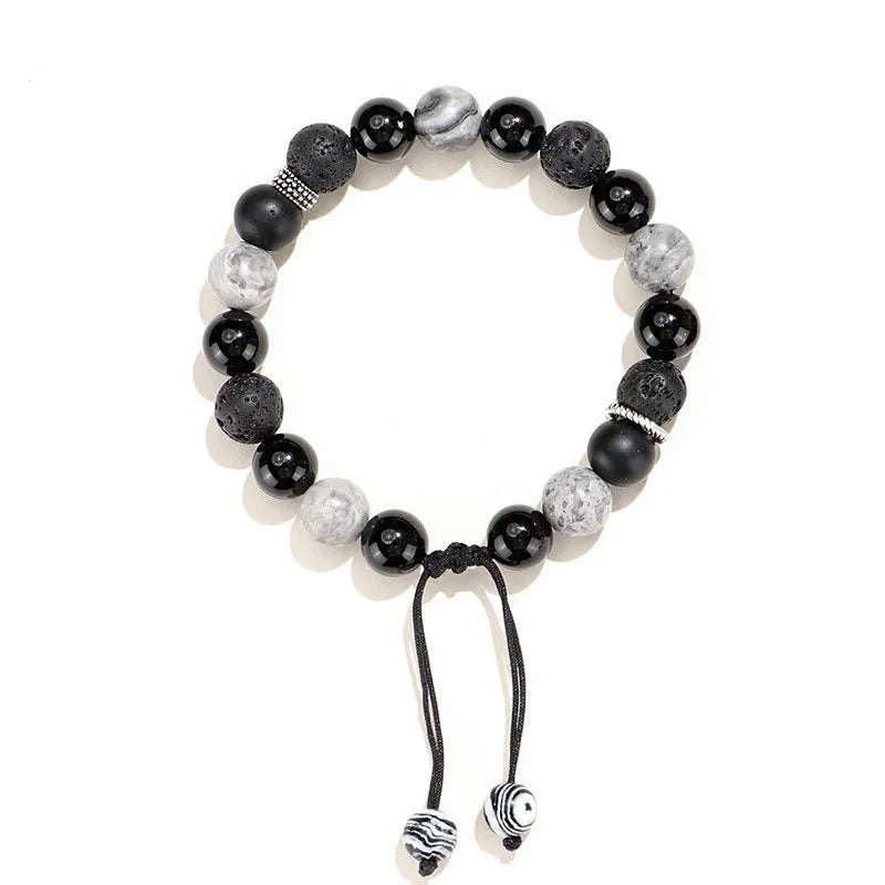 Black agate map stone and volcanic rock bracelet with diamond shaped beads in 8mm and 10mm sizes.
