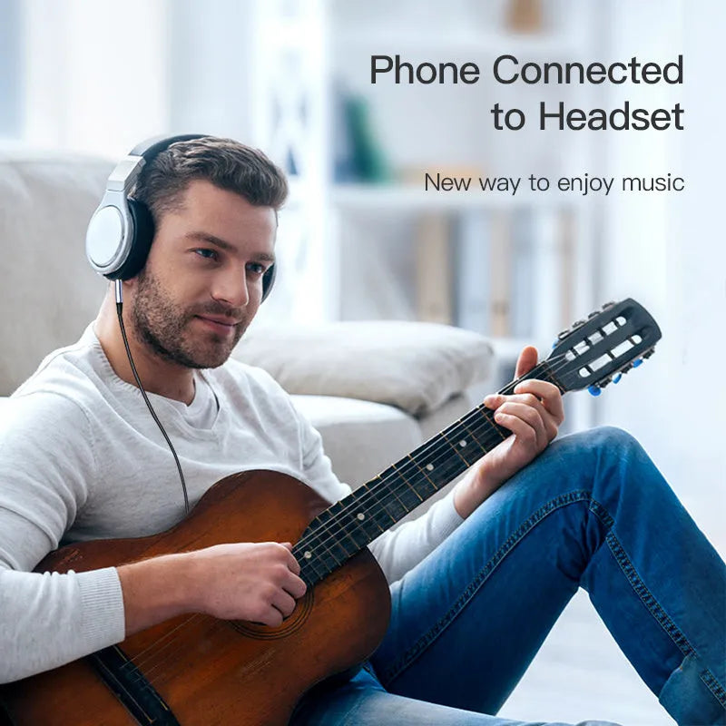 Nylon-braided audio cable with silver connector for headphone to car adapter connection.