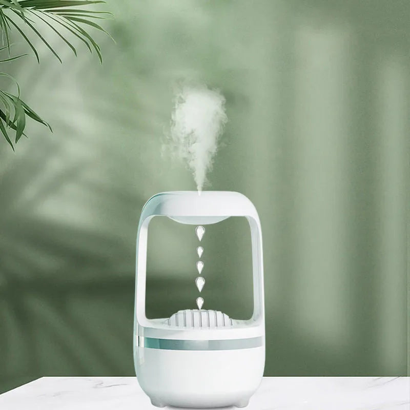 White anti-gravity humidifier showing water droplet backflow effect with USB cable connection