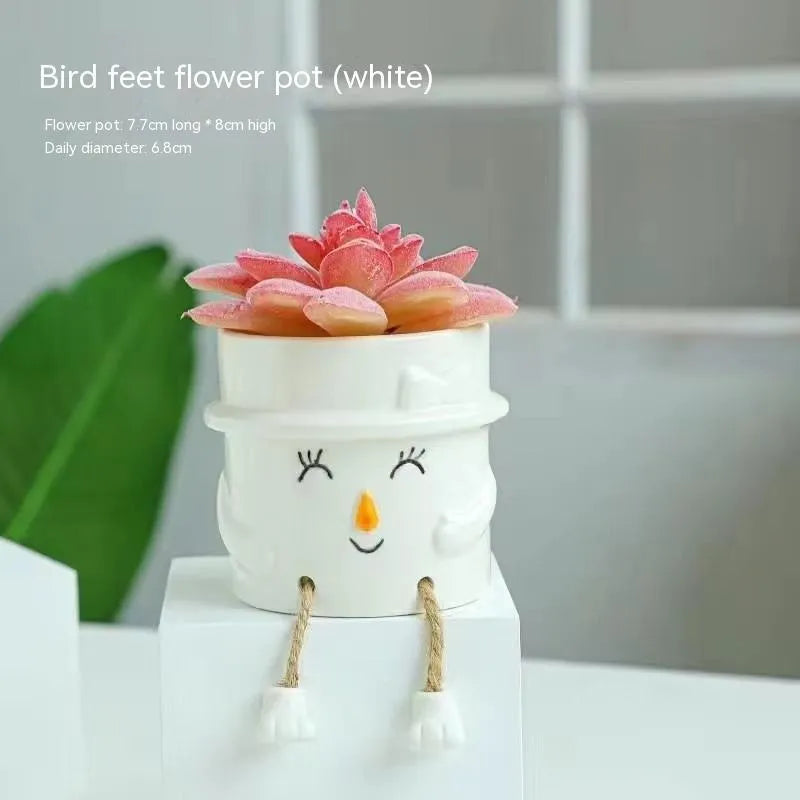 Ceramic hanging foot flowerpot for succulent plants in cartoon style with twelve colour variations on desktop
