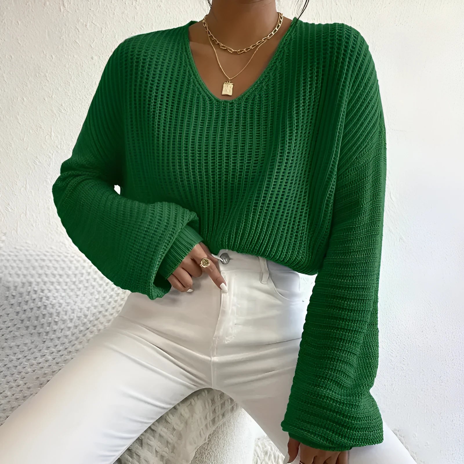 Women's solid color long sleeve pullover top in loose casual fit made of polyester