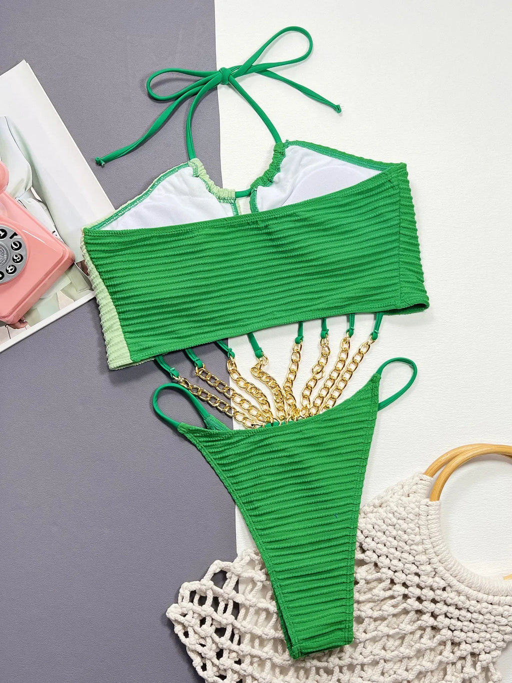 Green women's one-piece swimsuit with front and back hollow cutouts and cheeky coverage bottom