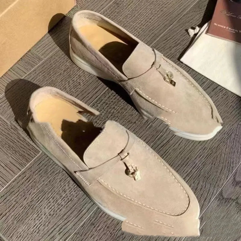 Slip-on high-top loafers in light gray with round toe and rubber sole.