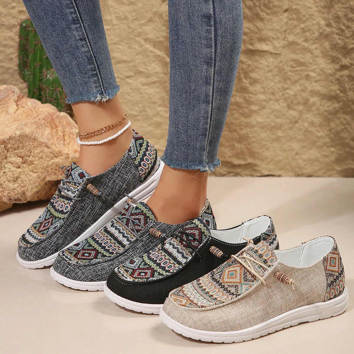 Women's black flat casual shoes with round toe and low-top design on a neutral background