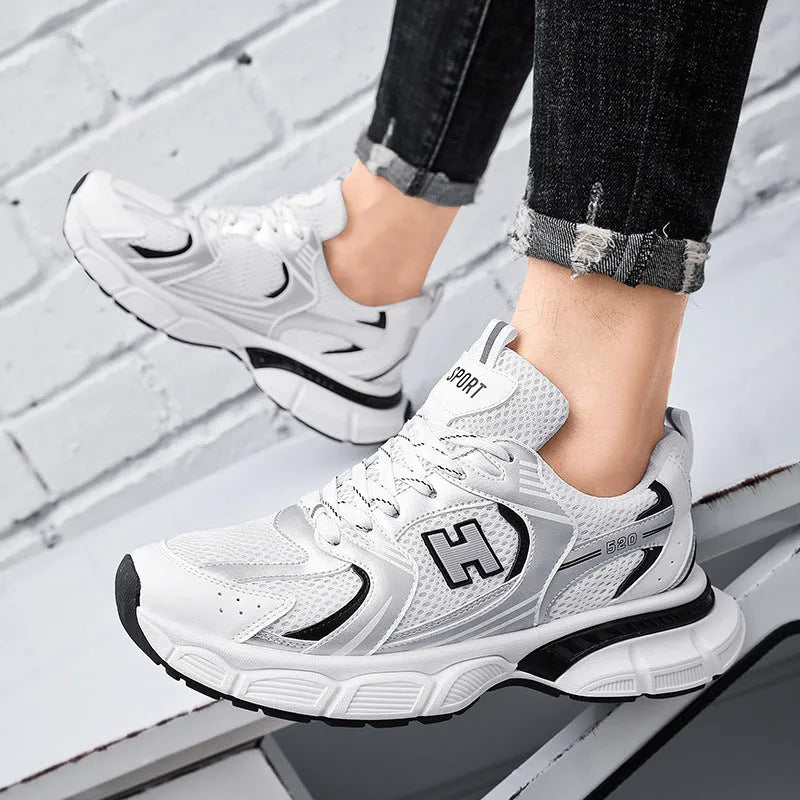 Men's mesh running shoes in black, white and gray, or white orange colours with plastic sole