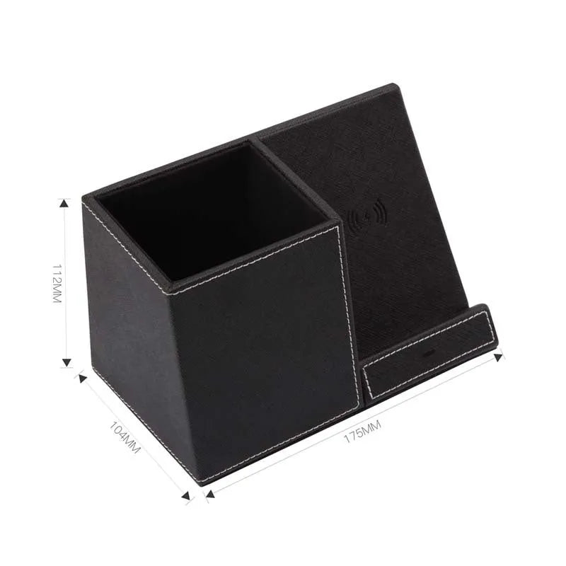 Black leather desk organiser with wireless phone charging pad and pen holder slots.