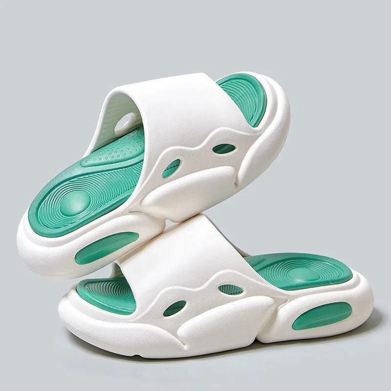 Women's two-colour EVA foam slippers with thick sole in pink and purple, shown on a foot.