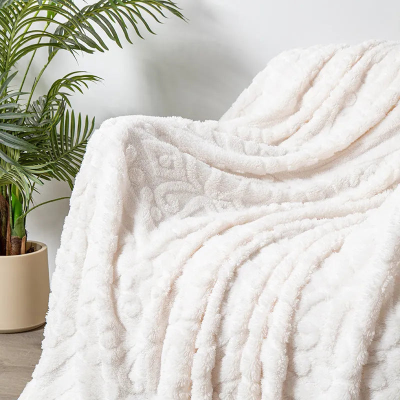 Polyester velvet jacquard blanket in fog blue colour showing texture and size on modern sofa