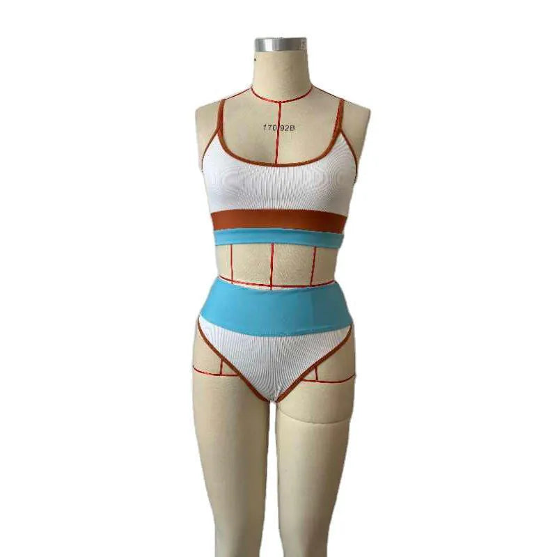 Women's solid colour quick-drying swimwear set with a top and matching shorts.