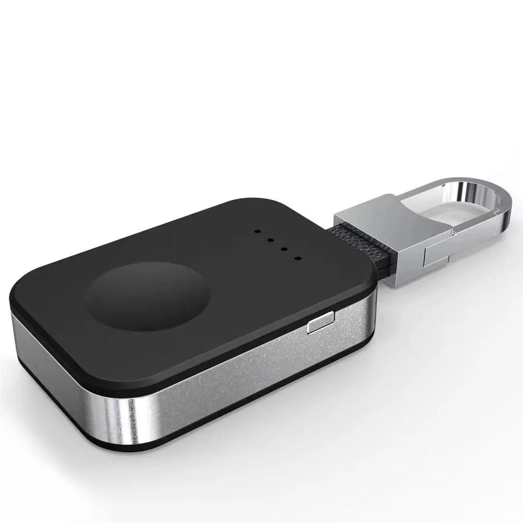 Black keychain-sized wireless power bank for Apple Watch showing front view and size relative to a keyring.