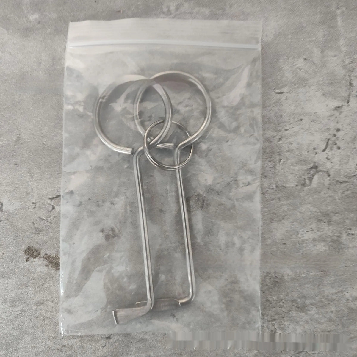 Two alloy wrench tools from a portable universal maintenance set.