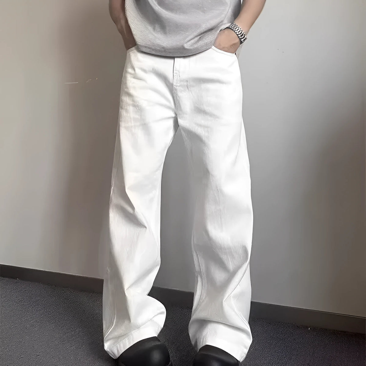Men's white straight leg jeans with wide leg opening and front zip fly
