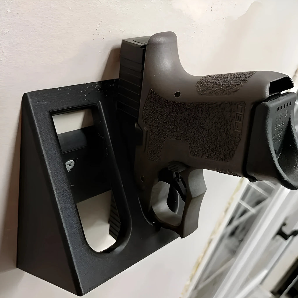 Black punk-style plastic pistol stand for replica firearms measuring 10.85cm tall