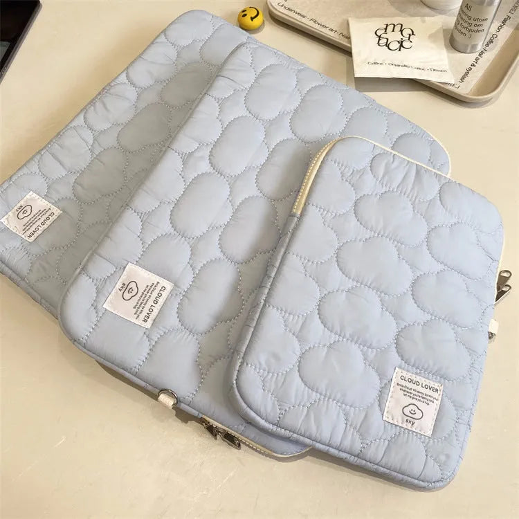 Cotton laptop sleeve with cloud embroidery in white or blue for 11 inch, 13-14 inch, and 15-15.6 inch devices.