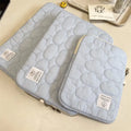 Cotton laptop sleeve with cloud embroidery in white or blue for 11 inch, 13-14 inch, and 15-15.6 inch devices.