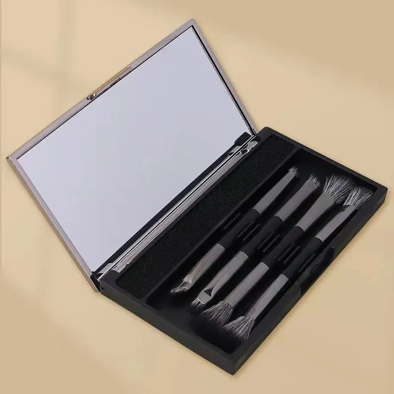 Makeup brush set with mirror case showing silver or gold handle eyeshadow brushes with artificial fibre bristles