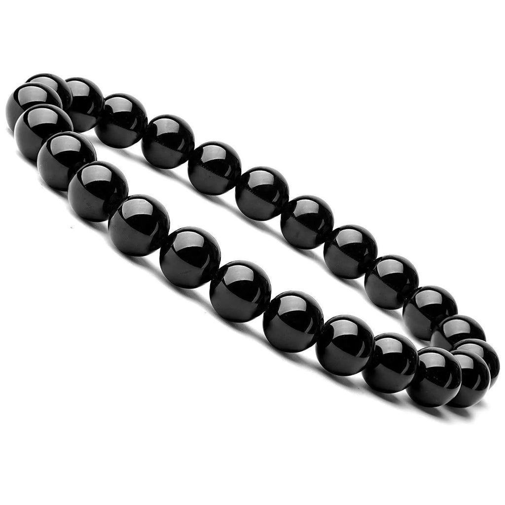 Close-up of a women's black onyx bracelet with 8mm geometric agate beads on a black elastic cord.