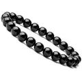 Close-up of a women's black onyx bracelet with 8mm geometric agate beads on a black elastic cord.