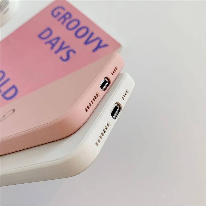 Solid colour TPU phone case for Apple iPhone in black, pink, and green showing precise cut-outs