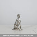 Modern resin leopard figurine ornament in American Leopard colour on a shelf.