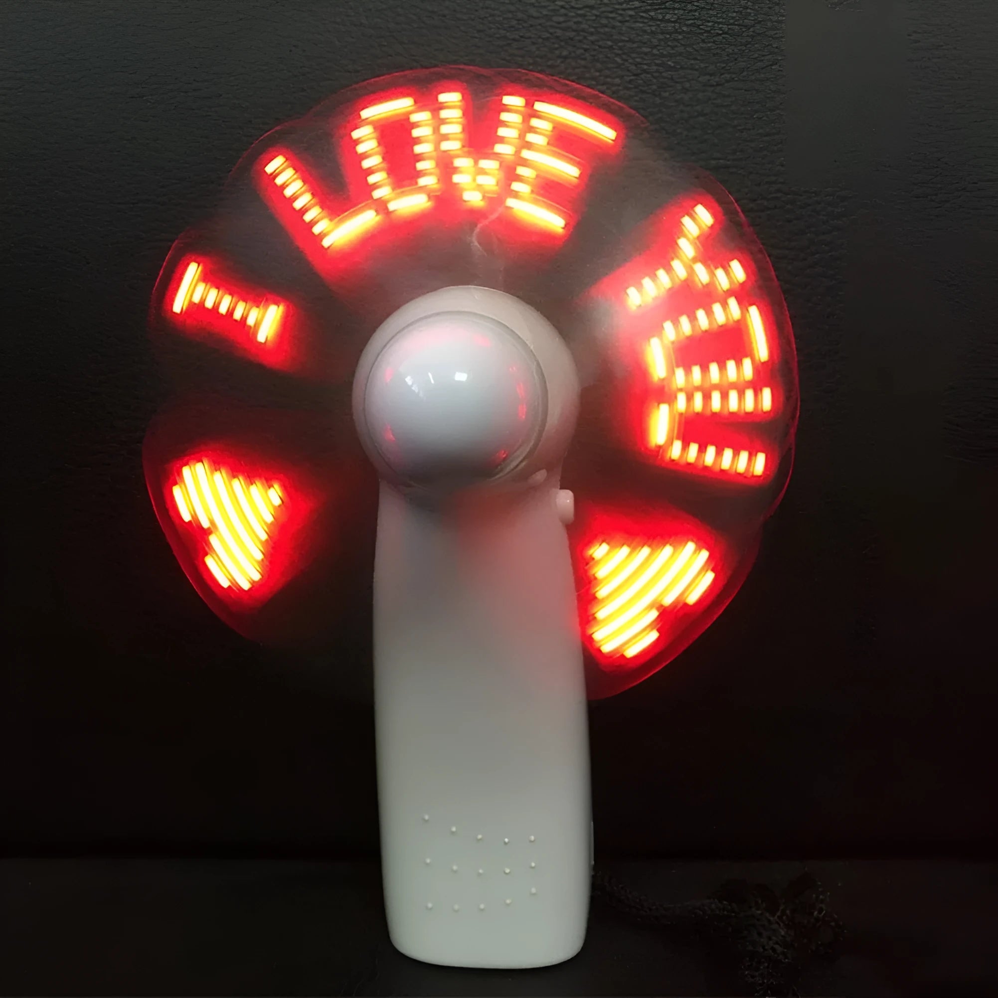 White handheld mini fan with blue and red LED lights flashing I love you pattern