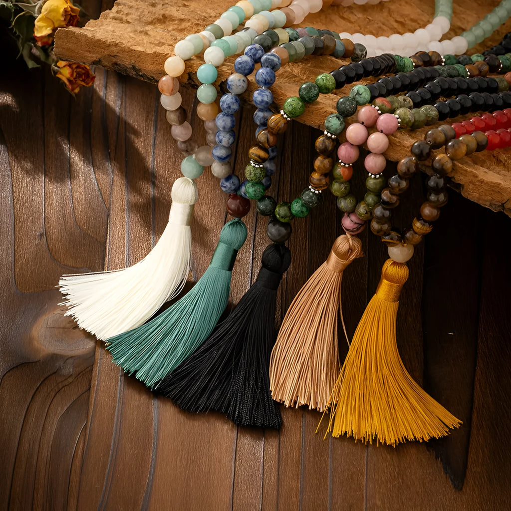 Vintage style long beaded necklace with geometric stone beads and matching bracelet in antique-inspired colours