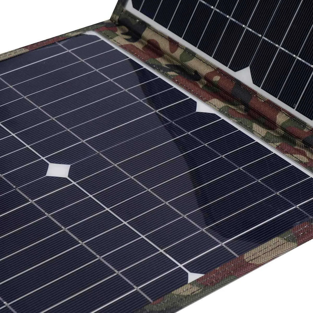 Black foldable solar panel unfolded showing three solar cells with included charging accessories
