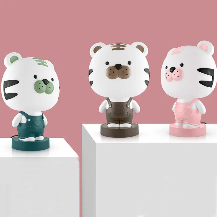 Animal table lamp with cartoon design showing bear, cattle, rabbit or tiger variations with LED light source