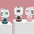 Animal table lamp with cartoon design showing bear, cattle, rabbit or tiger variations with LED light source