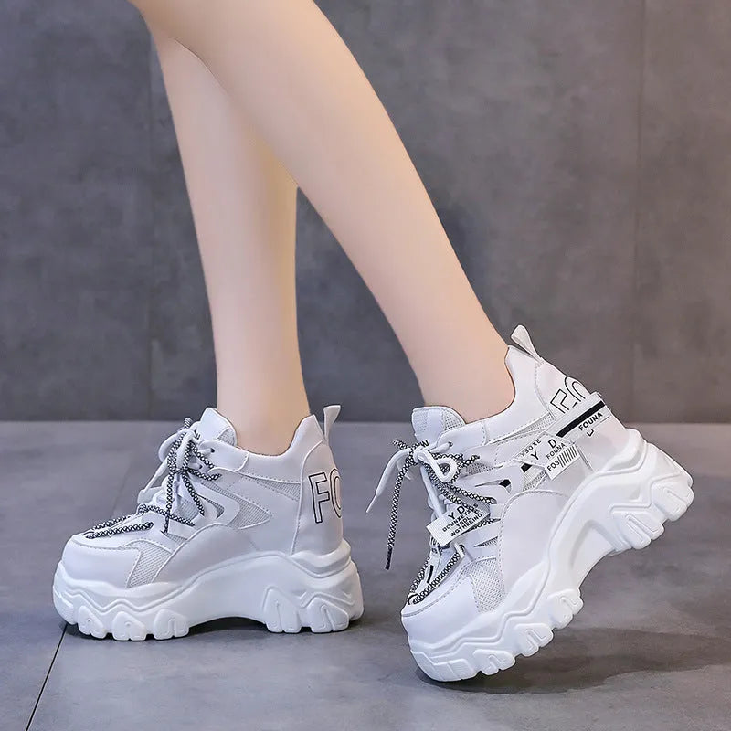 Women's white breathable mesh platform sports shoes with a cross strap and rubber sole.