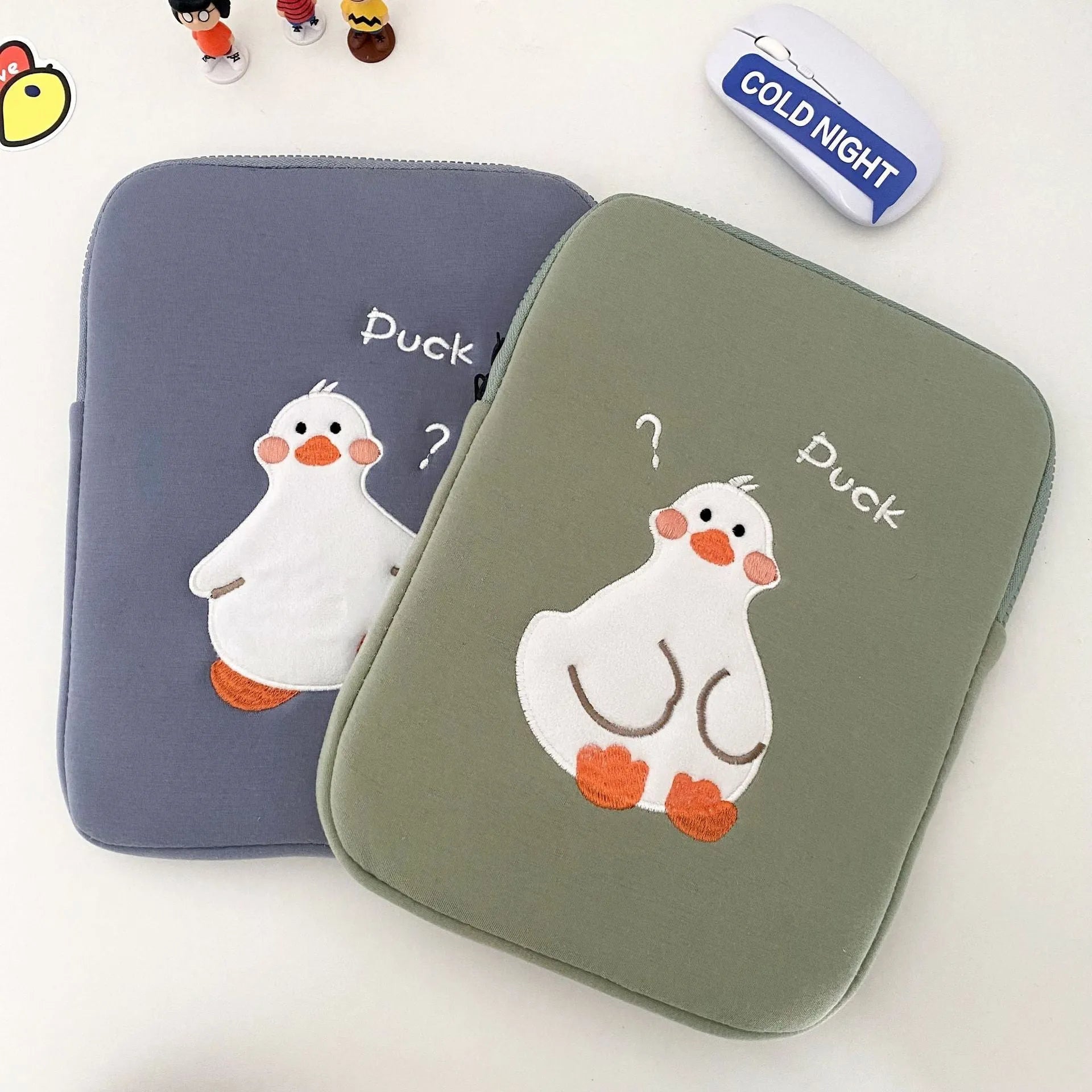 Blue cotton tablet case with embroidered duck design and zipper closure