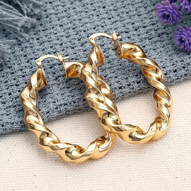 Geometric drop-shaped copper ear clips with ring and line design in electroplated finish