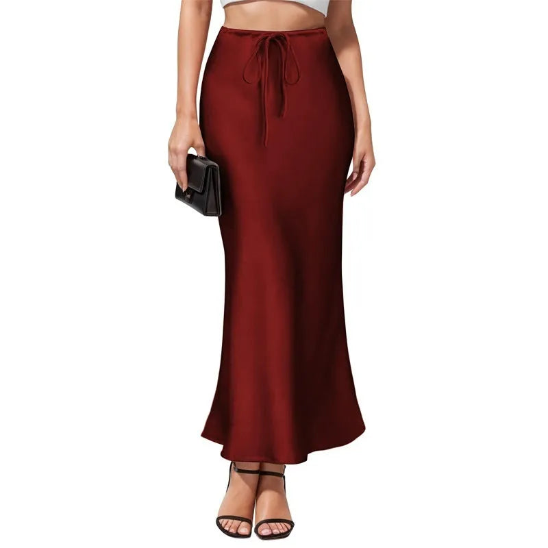 Asymmetric acetate satin skirt with irregular stitching in high waist design