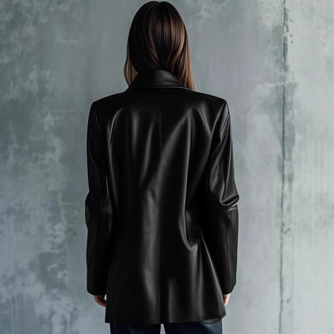 Black women's medium-length polyester jacket with long sleeves on a hanger.
