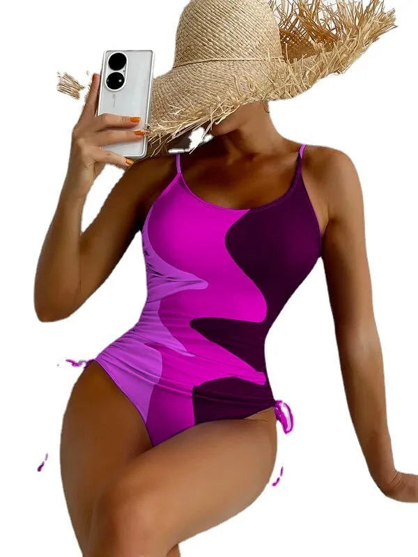 Women's blue one-piece sleeveless swimsuit with fixed swimming trunks on a mannequin.
