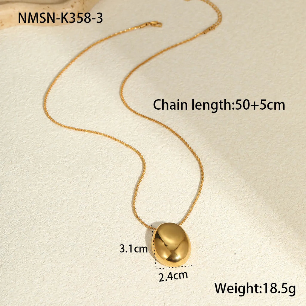 Gold geometric pendant necklace with adjustable chain on stainless steel background