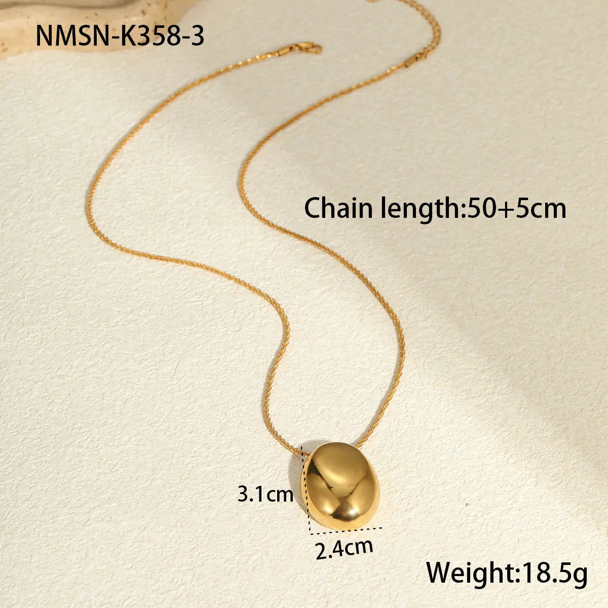Gold geometric pendant necklace with adjustable chain on stainless steel background