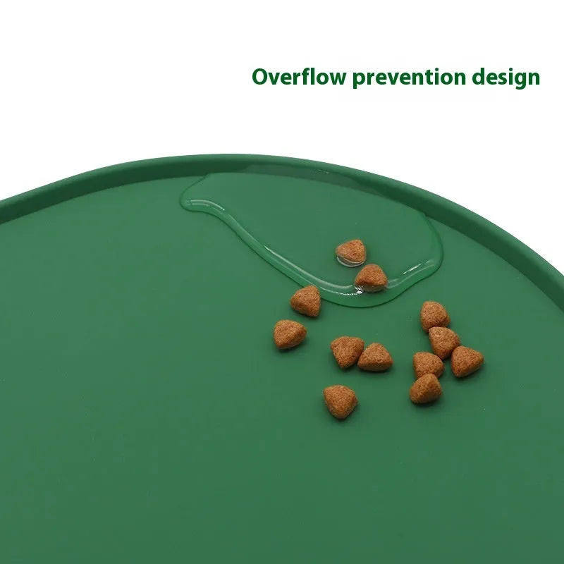 Silicone waterproof cat feeding placemat in green, shown under a food bowl.