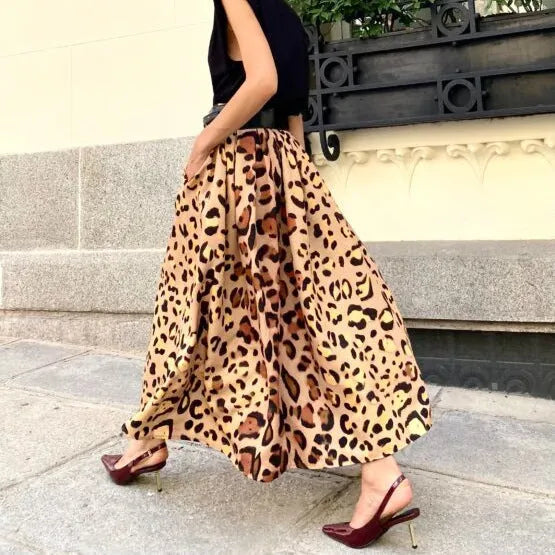Brown leopard print women's A-line long skirt with a big hem, laid flat.